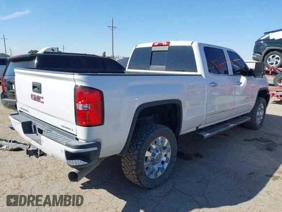 2019 GMC Sierra 2500HD Denali with VIN 1GT12SEY8KF139611, listed as a IAAI auction lot 41641028 with 69,776 mi miles. Bid and sale history available at carsss.com. Image 4.