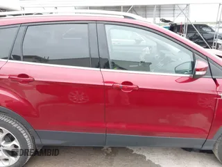 2015 Ford Escape Titanium with VIN 1FMCU0J98FUC07196, listed as a IAAI auction lot 41930660 with 51,161 mi miles and . Bid and sale history available at DreamBid. Image 13.