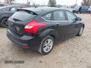 2012 Ford Focus SEL with VIN 1FAHP3M28CL336001, listed as a IAAI auction lot 40876771 with 147,017 mi miles. Bid and sale history available at carsss.com. Image 4.