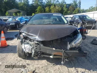 2019 Toyota Corolla L z VIN 5YFBURHE7KP880821, wystawiony jako Copart lot #61599055 z przebiegiem 105 856 mil mil oraz Czysty tytuł • Clean title. Historia ofert i sprzedaży dostępna na DreamBid. Obrazek 5.
