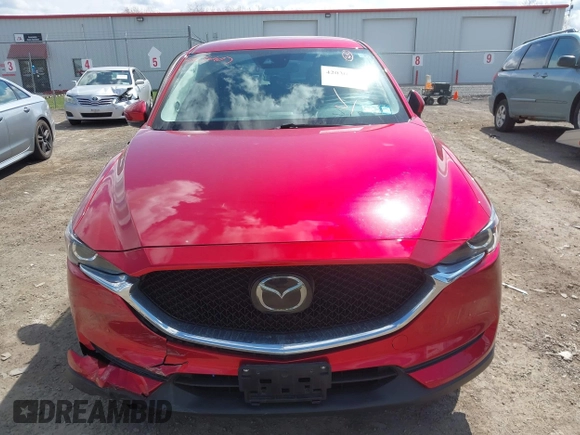 2021 Mazda CX-5 Touring z VIN JM3KFBCM1M0401717, wystawiony jako IAAI lot #42036407 z przebiegiem 35 587 mil mil oraz . Historia ofert i sprzedaży dostępna na DreamBid. Obrazek 12.