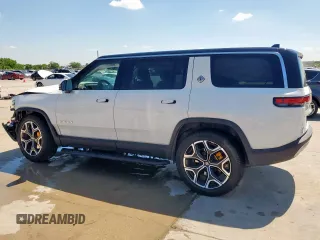 2023 Rivian R1S Launch Edition z VIN 7PDSGABL9PN010792, wystawiony jako Copart lot #56359465 z przebiegiem 24 319 mil mil oraz Szkoda całkowita • Salvage title. Historia ofert i sprzedaży dostępna na DreamBid. Obrazek 2.