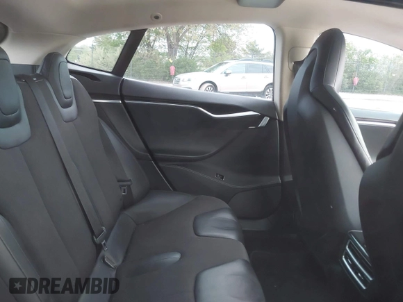 2013 Tesla Model S with VIN 5YJSA1CG9DFP27357, listed as a IAAI auction lot 42362514 with Not provided miles and . Bid and sale history available at DreamBid. Image 8.