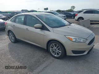 2018 Ford Focus SE z VIN 1FADP3FE4JL321370, wystawiony jako IAAI lot #42064646 z przebiegiem 91 325 mil mil oraz . Historia ofert i sprzedaży dostępna na DreamBid. Obrazek 1.
