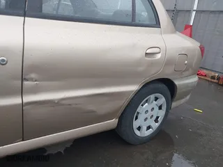 2002 Kia Rio with VIN KNADC123626192611, listed as a IAAI auction lot 41765104 with 62,387 mi miles. Bid and sale history available at carsss.com. Image 6.