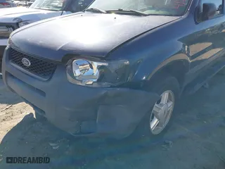 2003 Ford Escape XLS Popular with VIN 1FMYU02133KA02990, listed as a IAAI auction lot 41803174 with 140,792 mi miles. Bid and sale history available at carsss.com. Image 6.