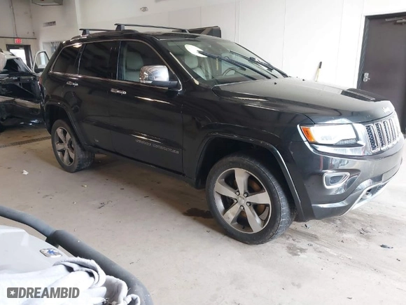 2014 Jeep Grand Cherokee Overland with VIN 1C4RJFCM4EC386398, listed as a IAAI auction lot 41696113 with 119,110 mi miles. Bid and sale history available at carsss.com. Image 1.