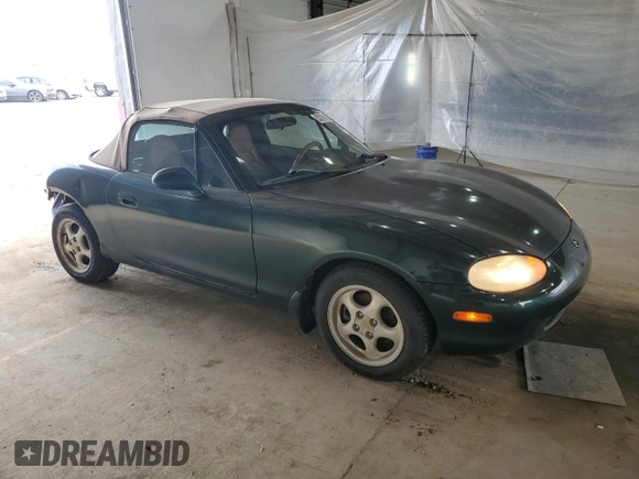 1999 Mazda MX-5 Miata z VIN JM1NB353XX0111850, wystawiony jako Copart lot #53076805 z przebiegiem 128 707 mil mil oraz Szkoda całkowita • Salvage title. Historia ofert i sprzedaży dostępna na DreamBid. Obrazek 4.
