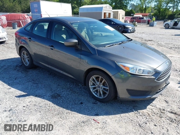 2018 Ford Focus SE z VIN 1FADP3FE1JL238012, wystawiony jako IAAI lot #42185232 z przebiegiem 143 687 mil mil oraz . Historia ofert i sprzedaży dostępna na DreamBid. Obrazek 1.