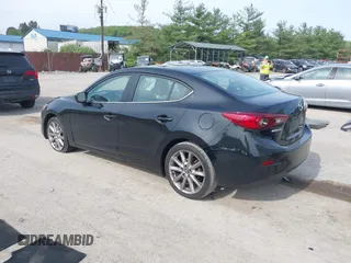 2017 Mazda 3 Touring z VIN 3MZBN1V74HM133565, wystawiony jako IAAI lot #42160836 z przebiegiem 104 997 mil mil oraz . Historia ofert i sprzedaży dostępna na DreamBid. Obrazek 3.