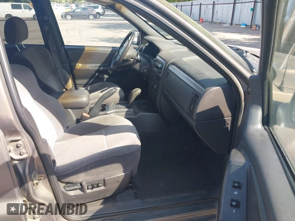 2001 Jeep Grand Cherokee Laredo with VIN 1J4GW48S81C694537, listed as a IAAI auction lot 42447828 with 162,981 mi miles and . Bid and sale history available at DreamBid. Image 5.