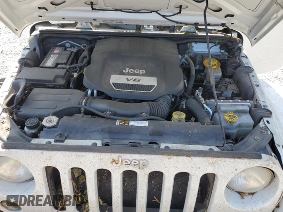 2014 Jeep Wrangler Unlimited Sahara z VIN 1C4BJWEG8EL188271, wystawiony jako Copart lot #59972535 z przebiegiem 130 314 mil mil oraz Szkoda całkowita • Salvage title. Historia ofert i sprzedaży dostępna na DreamBid. Obrazek 11.