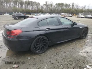 2015 BMW 6 Series 640i xDrive z VIN WBA6B8C5XFD453762, wystawiony jako Copart lot #44228965 z przebiegiem 105 188 mil mil oraz Szkoda całkowita • Salvage title. Historia ofert i sprzedaży dostępna na DreamBid. Obrazek 3.
