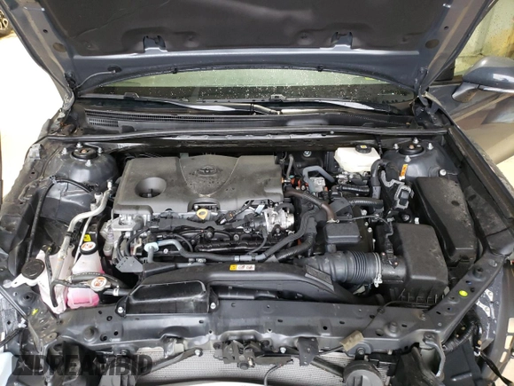 2025 Toyota Camry LE z VIN 4T1DAACK9SU506208, wystawiony jako Copart lot #56706605 z przebiegiem 17 651 mil mil oraz Szkoda całkowita • Salvage title. Historia ofert i sprzedaży dostępna na DreamBid. Obrazek 11.