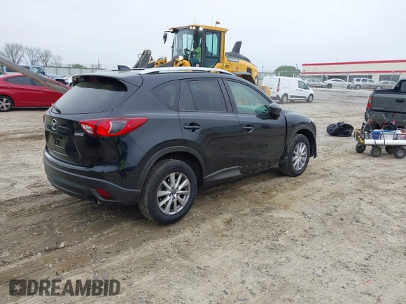 2014 Mazda CX-5 Touring with VIN JM3KE2CY7E0341658, listed as a IAAI auction lot 41915807 with 99,287 mi miles. Bid and sale history available at carsss.com. Image 4.