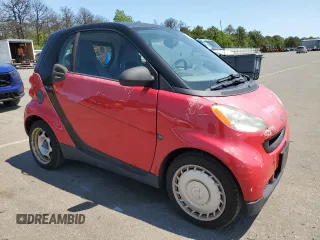 2009 Smart fortwo Pure with VIN WMEEJ31X49K322711, listed as a Copart auction lot 58749945 with 58,919 mi miles and Clean title. Bid and sale history available at DreamBid. Image 4.