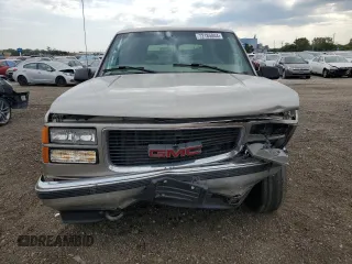 1999 GMC Yukon with VIN 1GKEK13R9XJ787877, listed as a Copart auction lot 72185044 with 191,710 mi miles and Salvage Title. Bid and sale history available at carsss.com. Image 5.