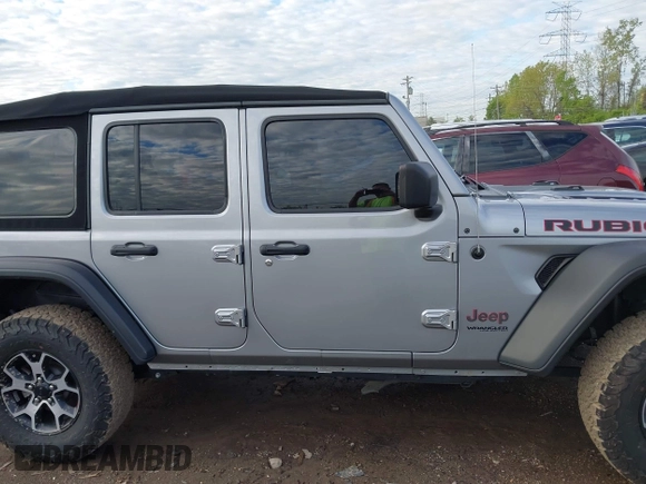 2021 Jeep Wrangler Unlimited Rubicon with VIN 1C4HJXFNXMW560512, listed as a IAAI auction lot 42124812 with 18,034 mi miles and . Bid and sale history available at DreamBid. Image 14.