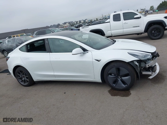 2019 Tesla Model 3 Long Range with VIN 5YJ3E1EB2KF361541, listed as a IAAI auction lot 41859373 with 54,664 mi miles. Bid and sale history available at carsss.com. Image 14.