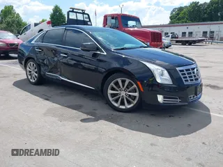 2014 Cadillac XTS Luxury z VIN 2G61N5S30E9170305, wystawiony jako IAAI lot #42223317 z przebiegiem 103 692 mil mil oraz . Historia ofert i sprzedaży dostępna na DreamBid. Obrazek 1.