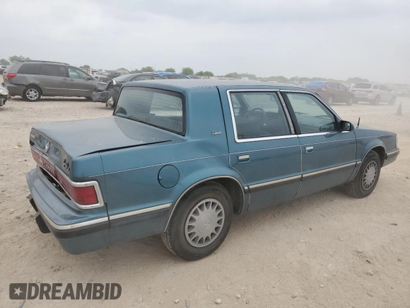 1993 Dodge Dynasty LE z VIN 1B3XC56R3PD124521, wystawiony jako Copart lot #51825725 z przebiegiem 94 336 mil mil oraz Szkoda całkowita • Salvage title. Historia ofert i sprzedaży dostępna na DreamBid. Obrazek 3.