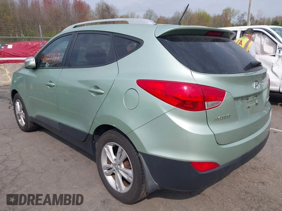 2013 Hyundai Tucson GLS with VIN KM8JU3AC7DU580229, listed as a IAAI auction lot 42127349 with 204,975 mi miles. Bid and sale history available at carsss.com. Image 3.