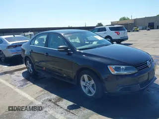 2014 Volkswagen Jetta TDI w/Premium with VIN 3VWLL7AJ2EM285077, listed as a IAAI auction lot 42221751 with 156,790 mi miles and . Bid and sale history available at DreamBid. Image 1.
