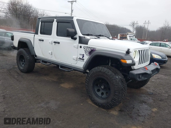 2020 Jeep Gladiator Sport S z VIN 1C6HJTAG0LL129461, wystawiony jako IAAI lot #41464713 z przebiegiem 66 625 mil mil oraz . Historia ofert i sprzedaży dostępna na DreamBid. Obrazek 1.