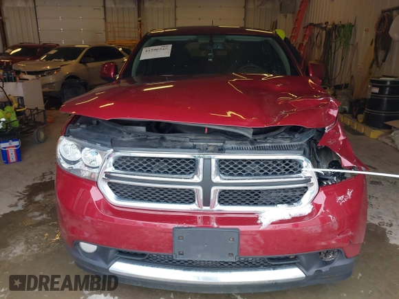 2013 Dodge Durango SXT with VIN 1C4RDJAG4DC527945, listed as a IAAI auction lot 41590545 with 141,074 mi miles and . Bid and sale history available at DreamBid. Image 13.