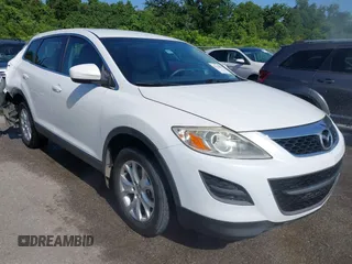 2012 Mazda CX-9 Sport z VIN JM3TB2BA8C0358676, wystawiony jako IAAI lot #42531892 z przebiegiem 141 843 mil mil oraz . Historia ofert i sprzedaży dostępna na DreamBid. Obrazek 1.