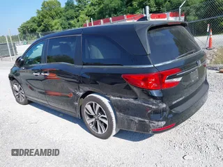 2021 Honda Odyssey Touring with VIN 5FNRL6H84MB027396, listed as a IAAI auction lot 42616650 with 67,207 mi miles and . Bid and sale history available at DreamBid. Image 3.
