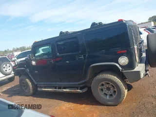 2003 Hummer H2 with VIN 5GRGN23U33H144379, listed as a IAAI auction lot 41452982 with 227,746 mi miles. Bid and sale history available at carsss.com. Image 14.