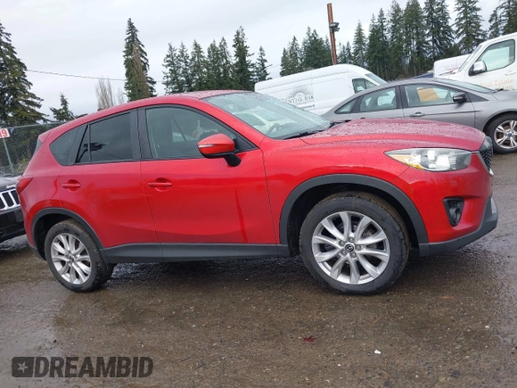 2015 Mazda CX-5 Grand Touring with VIN JM3KE4DY0F0479392, listed as a IAAI auction lot 41659415 with 141,403 mi miles. Bid and sale history available at carsss.com. Image 13.
