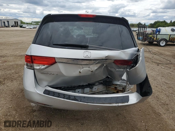 2014 Honda Odyssey LX z VIN 5FNRL5H21EB106600, wystawiony jako Copart lot #57875765 z przebiegiem 122 159 mil mil oraz Szkoda całkowita • Salvage title. Historia ofert i sprzedaży dostępna na DreamBid. Obrazek 6.