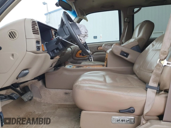 1999 Chevrolet Suburban with VIN 3GNEC16R9XG143471, listed as a Copart auction lot 53856565 with 208,621 mi miles and Salvage title. Bid and sale history available at DreamBid. Image 7.