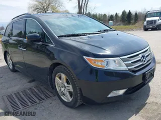 2011 Honda Odyssey Touring with VIN 5FNRL5H94BB027995, listed as a IAAI auction lot 42039709 with 225,439 mi miles. Bid and sale history available at carsss.com. Image 1.