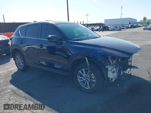 2023 Mazda CX-5 S Carbon Edition z VIN JM3KFBCM7P0197669, wystawiony jako IAAI lot #41992110 z przebiegiem 15 476 mil mil oraz . Historia ofert i sprzedaży dostępna na DreamBid. Obrazek 1.
