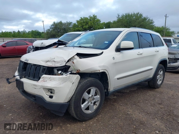 2012 Jeep Grand Cherokee Laredo with VIN 1C4RJFAG5CC224032, listed as a IAAI auction lot 42069334 with 106,614 mi miles. Bid and sale history available at carsss.com. Image 18.