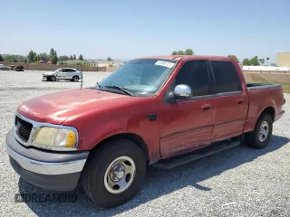 2001 Ford F-150 XLT with VIN 1FTRW07L01KF03457, listed as a Copart auction lot 60086725 with 205,917 mi miles and Salvage title. Bid and sale history available at DreamBid. Image 1.