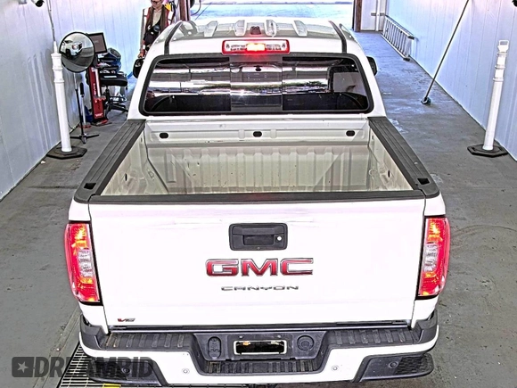 2021 GMC Canyon 2WD Elevation z VIN 1GTG5CEN5M1140499, wystawiony jako IAAI lot #42556124 z przebiegiem 41 450 mil mil oraz . Historia ofert i sprzedaży dostępna na DreamBid. Obrazek 6.