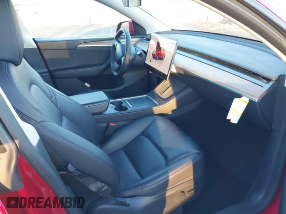 2023 Tesla Model Y Long Range with VIN 7SAYGDEE1PF860207, listed as a IAAI auction lot 41101287 with 24,320 mi miles. Bid and sale history available at carsss.com. Image 5.