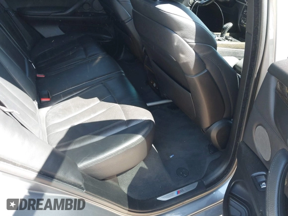 2014 BMW X5 xDrive50i with VIN 5UXKR6C57E0J72301, listed as a IAAI auction lot 39379887 with 117,012 mi miles. Bid and sale history available at carsss.com. Image 8.
