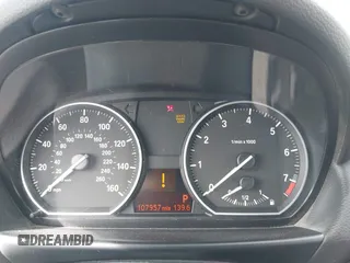 2012 BMW 1 Series 128i with VIN WBAUN1C52CVR00421, listed as a IAAI auction lot 41594256 with 107,957 mi miles and . Bid and sale history available at DreamBid. Image 7.