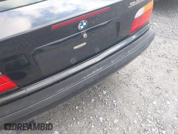 1999 BMW 3 Series 323i with VIN WBABJ8330XEM23911, listed as a IAAI auction lot 42523948 with 125,371 mi miles and . Bid and sale history available at DreamBid. Image 6.