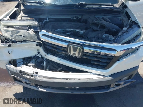 2019 Honda Ridgeline RTL-E with VIN 5FPYK3F74KB009279, listed as a IAAI auction lot 42348773 with 98,141 mi miles and . Bid and sale history available at DreamBid. Image 10.