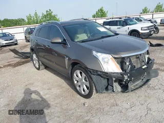 2016 Cadillac SRX Premium Collection z VIN 3GYFNDE3XGS526820, wystawiony jako IAAI lot #42242519 z przebiegiem 128 766 mil mil oraz . Historia ofert i sprzedaży dostępna na DreamBid. Obrazek 1.