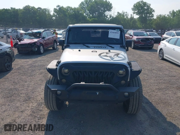 2012 Jeep Wrangler Sport z VIN 1C4AJWAG9CL255278, wystawiony jako IAAI lot #42469091 z przebiegiem 140 480 mil mil oraz . Historia ofert i sprzedaży dostępna na DreamBid. Obrazek 13.