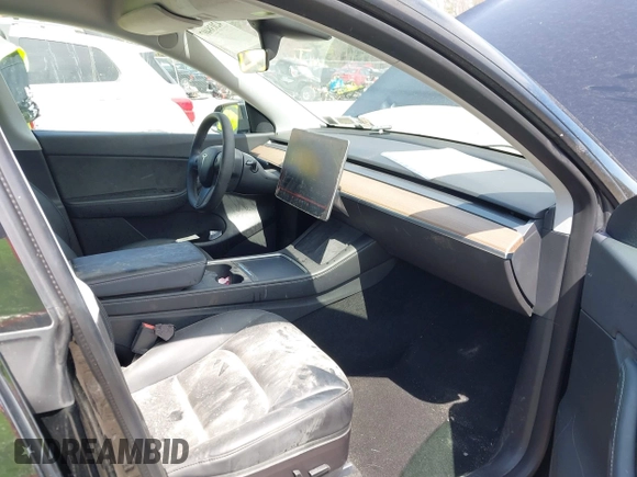 2022 Tesla Model Y Performance with VIN 7SAYGDEF7NF310113, listed as a IAAI auction lot 42038407 with 46,052 mi miles and . Bid and sale history available at DreamBid. Image 5.