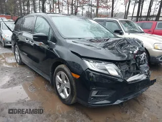 2019 Honda Odyssey EX-L with VIN 5FNRL6H75KB087076, listed as a IAAI auction lot 41796779 with 136,491 mi miles. Bid and sale history available at carsss.com. Image 1.