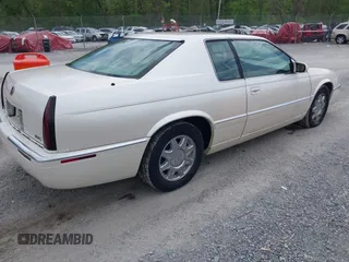 1997 Cadillac Eldorado Touring with VIN 1G6ET1293VU604921, listed as a IAAI auction lot 42113040 with 57,029 mi miles and . Bid and sale history available at DreamBid. Image 4.